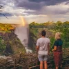Tourists enjoying a safe view of Victoria Falls in Zimbabwe.