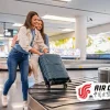 Passengers collecting luggage under Air China baggage policy guidelines at airport