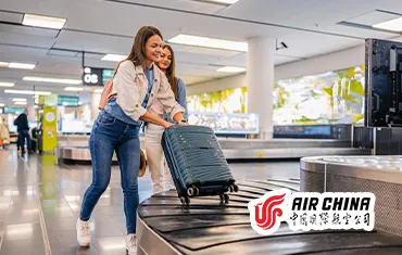 Passengers collecting luggage under Air China baggage policy guidelines at airport